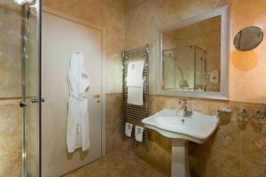 Koupelna v ubytování Hotel Actum