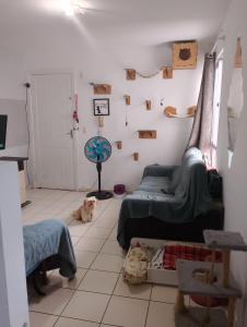 a room with a bed and a dog laying on the floor at Quarto casal ARENA OPUS in São José