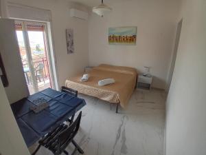 Postel nebo postele na pokoji v ubytování bbsulmare-com Viola Apartment