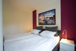 Postel nebo postele na pokoji v ubytování Haus Meeresgruß App 13 + 8 fotografií