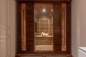 een houten deur met een vogel erin bij Heart of Cannes Luxury Stay - Steps from Beach & Palais in Cannes