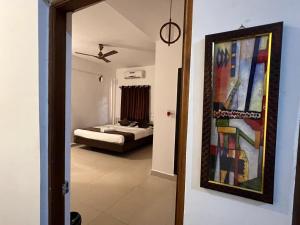 Postel nebo postele na pokoji v ubytování Aura rooms & swimming pool, calangute