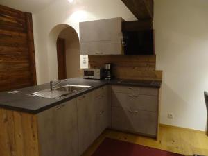a kitchen with a sink and a microwave at Ziegenblick in Nauders