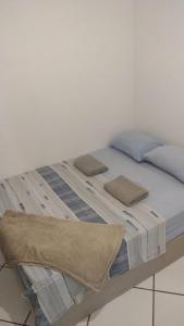 En eller flere senge i et værelse på Loft proximo a praia da Guarderia e shopping Vitória