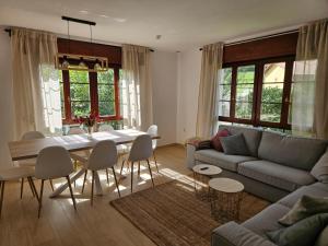 a living room with a table and a couch at El Tayo in Cudillero