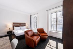 Postel nebo postele na pokoji v ubytování Hôtel Sainte-Anne
