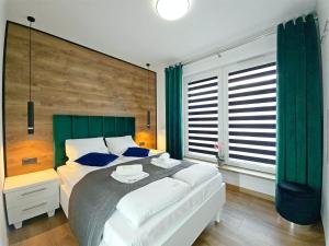 Ένα ή περισσότερα κρεβάτια σε δωμάτιο στο CLASSY APARTMENTS - AQUAPARK Reda Deluxe