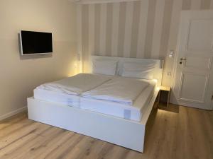 Postel nebo postele na pokoji v ubytování Landhaus am Meer - Whg 5 Hilligenlei
