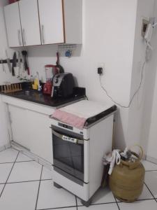 Køkken eller tekøkken på Loft proximo a praia da Guarderia e shopping Vitória