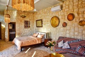 Una cama o camas en una habitación de Le Sunset De Abdelle