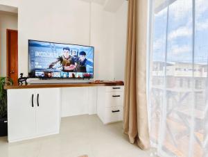 Una televisión o centro de entretenimiento en IXA Amakan Loft