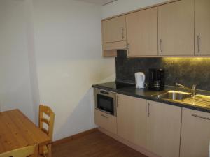 Cucina o angolo cottura di Wohnung GREPPON NEND200 Ski in and Ski out