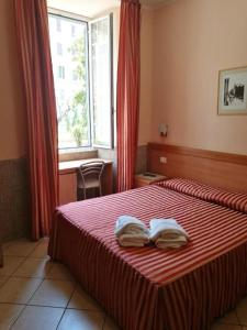 Postel nebo postele na pokoji v ubytování Palma Residences In Rome