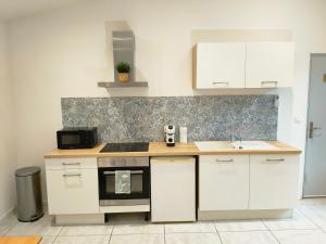 Η κουζίνα ή μικρή κουζίνα στο Joli appartement Urbain +5 φωτογραφίες