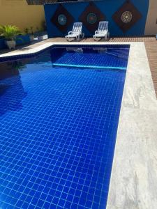 A piscina localizada em Pousada Kembali Maresias ou nos arredores