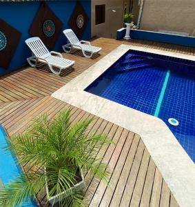 A piscina localizada em Pousada Kembali Maresias ou nos arredores