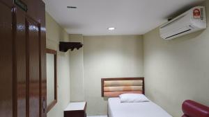 Piccola camera con 2 letti e riscaldamento. di HOTEL MEDAN KiDD a Ipoh