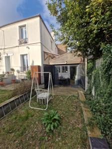 Κήπος έξω από το Studio 22m2 proche Paris station Aerobus Beauvais