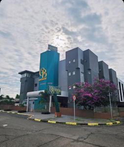 a large building with a sign in front of it at GB Hotéis Foz in Foz do Iguaçu