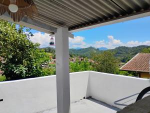 a view from the balcony of a house at Casinha no Centro in Santo Antônio do Pinhal