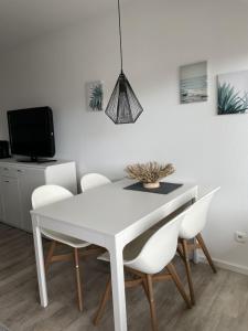 TV a/nebo společenská místnost v ubytování Villa am Meer App 42 "Seeperle"