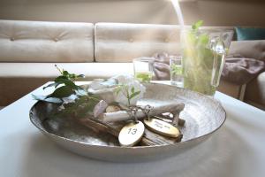 a bowl on a table with some items on it at Haus am Park Whg13 in Spiekeroog +4 photos