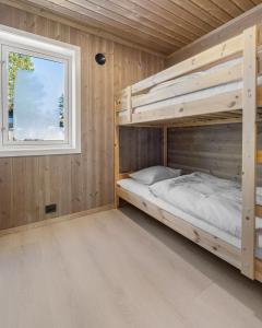 Ένα ή περισσότερα κρεβάτια σε δωμάτιο στο Feriehus med flott utsikt