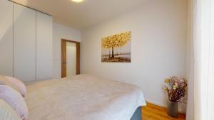 Posteľ alebo postele v izbe v ubytovaní 3D Park Living Apartment