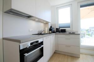 Η κουζίνα ή μικρή κουζίνα στο Haus Barbara - Schwimmbad und Sauna im Haus-Whg 11