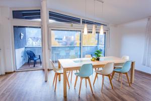 a dining room with a table and chairs at City Dream 1 by Alpenidyll Apartments in Schladming