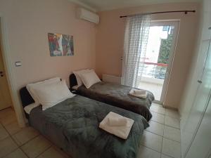 Postel nebo postele na pokoji v ubytování Elysian Dreams at Patras