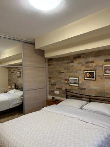Postel nebo postele na pokoji v ubytování ''Shinohori'' Olive-Tree Apartment + 24 fotografií