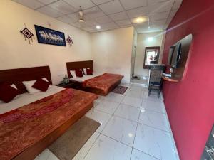 Postel nebo postele na pokoji v ubytování Samarth home stay