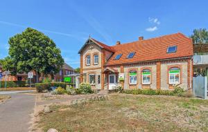 a large brick house with a red roof at Ferienwohnung Dabel in Dabel +17 photos