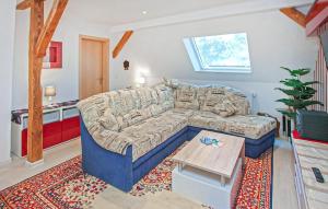 a living room with a couch and a table at Ferienwohnung Dabel in Dabel