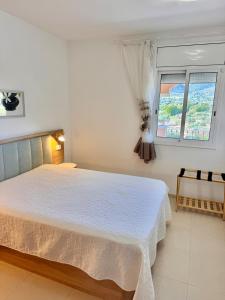 Ένα ή περισσότερα κρεβάτια σε δωμάτιο στο Ático Golden Beach - costa Dorada - La Ràpita -Tarragona