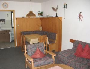 Posezení v ubytování Ferienhaus Nr 125, Kategorie Economy, Feriendorf Hochbergle, Allgäu
