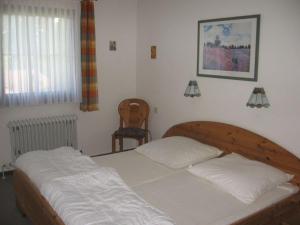 Postel nebo postele na pokoji v ubytování Ferienhaus Nr 125, Kategorie Economy, Feriendorf Hochbergle, Allgäu