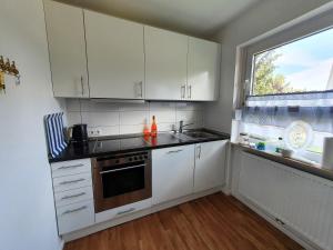 Kuchyň nebo kuchyňský kout v ubytování Ferienhaus Marina III + 10 fotografií