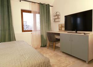 Televisyen dan/atau pusat hiburan di Bavaria Rooms +19 gambar