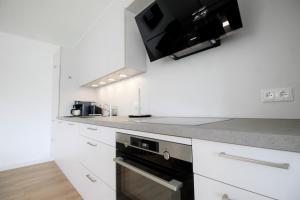 Η κουζίνα ή μικρή κουζίνα στο Haus Barbara - Schwimmbad und Sauna im Haus-Whg 10