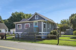 a house on the side of a street at Bue Crab Bungalow - Charming in-town cottage! in Birch Town