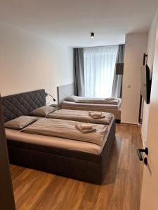 Postel nebo postele na pokoji v ubytování SORRY-HORY Apartmán Dolní Morava