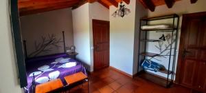 Postel nebo postele na pokoji v ubytování CTR Casona Santa Coloma