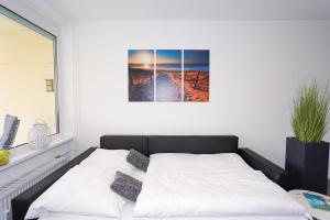Postel nebo postele na pokoji v ubytování Strandburg 4