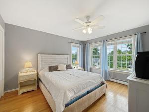 a bedroom with a bed and a ceiling fan at Beach House in York