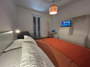 Postel nebo postele na pokoji v ubytování Flo Guest House