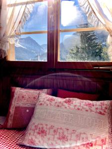 Кровать или кровати в номере Chalet Arosa - Zur Alleinnutzung für 6 Personen, urig und sonnig