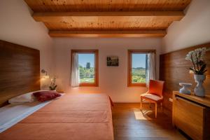 Postel nebo postele na pokoji v ubytování Borgo Ronchetto + 37 fotografií
