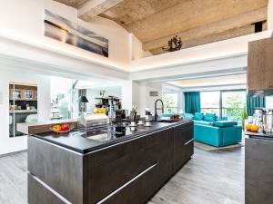 a kitchen with a large counter top in a room at FeWo Prora - Stella Maris Dachterrasse in Binz